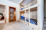 Lower level living area with built-in bunk beds that sleeps 2
